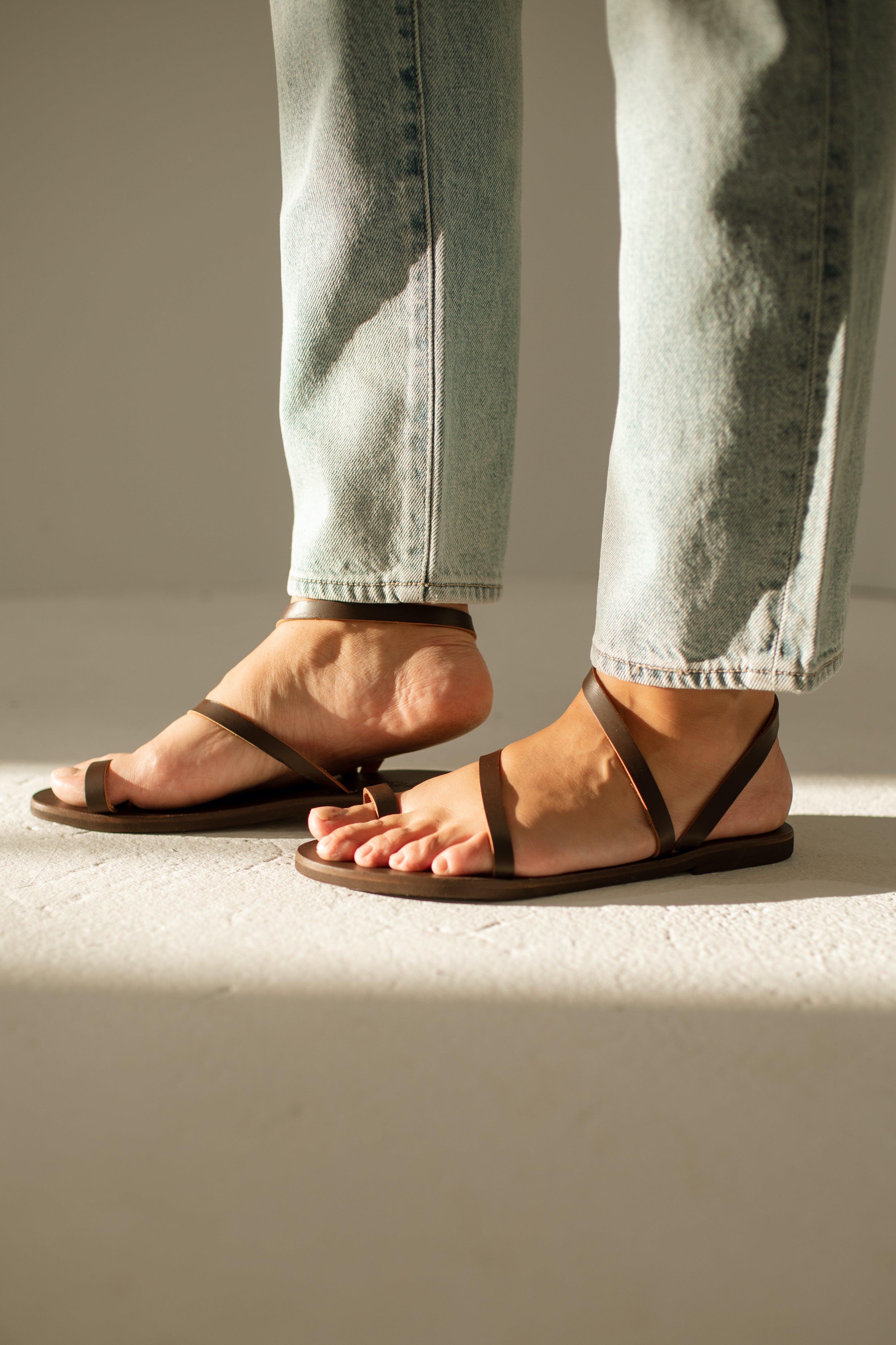 RHODES STUDDED THONG SANDALS IN WHITE CALFSKIN